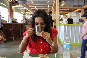 Didi sipping coffee at 7th st public market