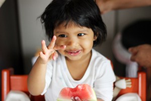 Asha showing she is two with her fingers