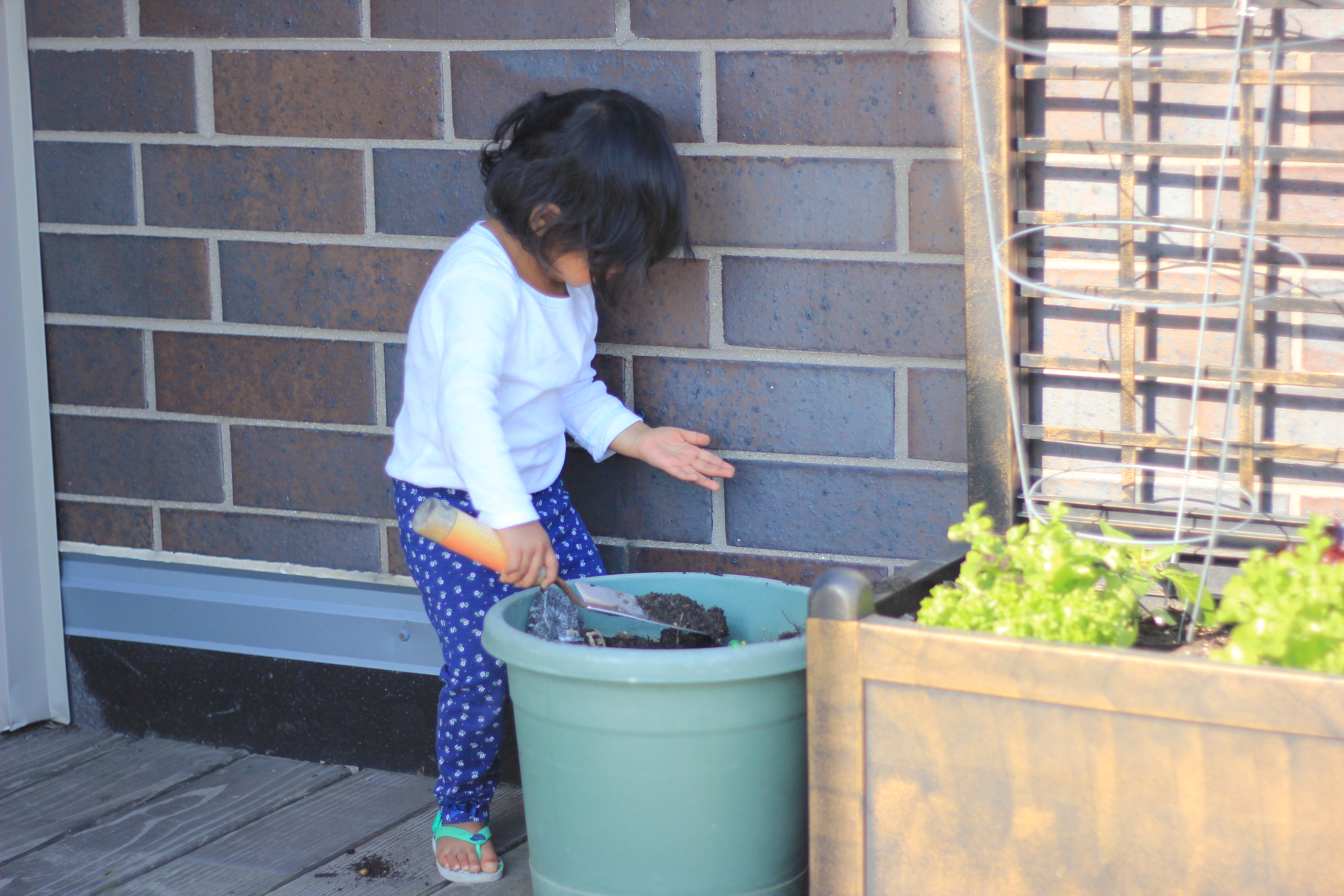 Asha Gardening and playing with dirt
