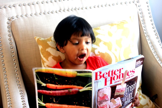 Asha reading Better Homes
