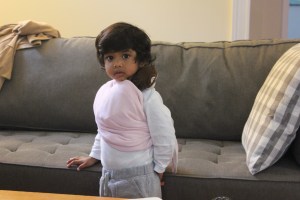 Asha wearing Monkey in a sling