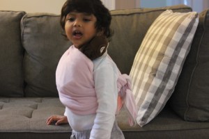 Asha wearing Monkey in a sling