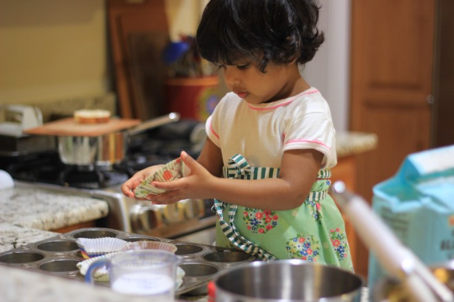 Asha baking cupcakes