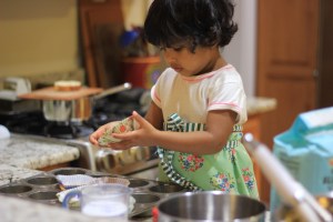 Asha baking cupcakes