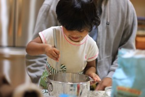 Asha baking cupcakes