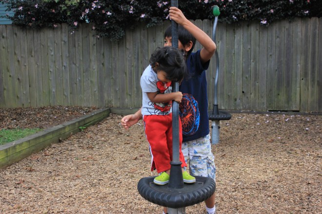 Asha and Aashrai playing in the playground
