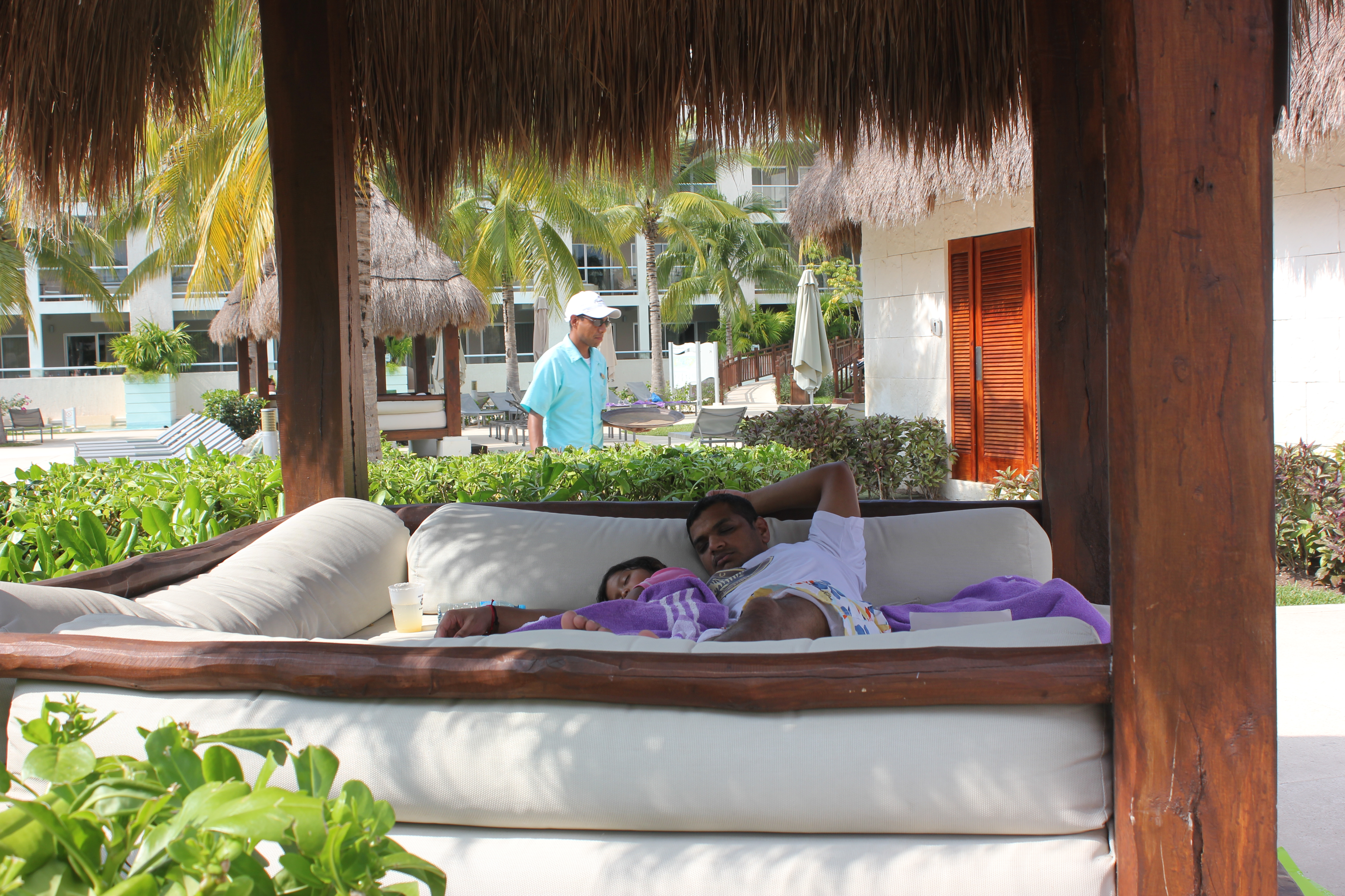 Asha and Arjun napping in a palapa by the pool in Paradisus playa del carmen, Mexico